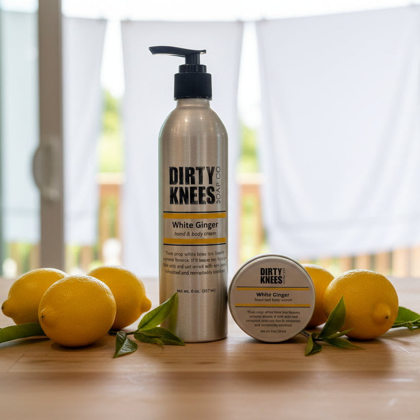 two bottle of dirty kneed white ginger scented lotion. one is 2 ounces, the other is 8 ounces