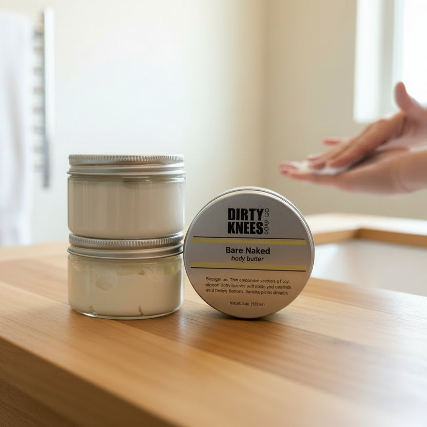 Two containers of 'Dirty Knees' body butter on a white surface.